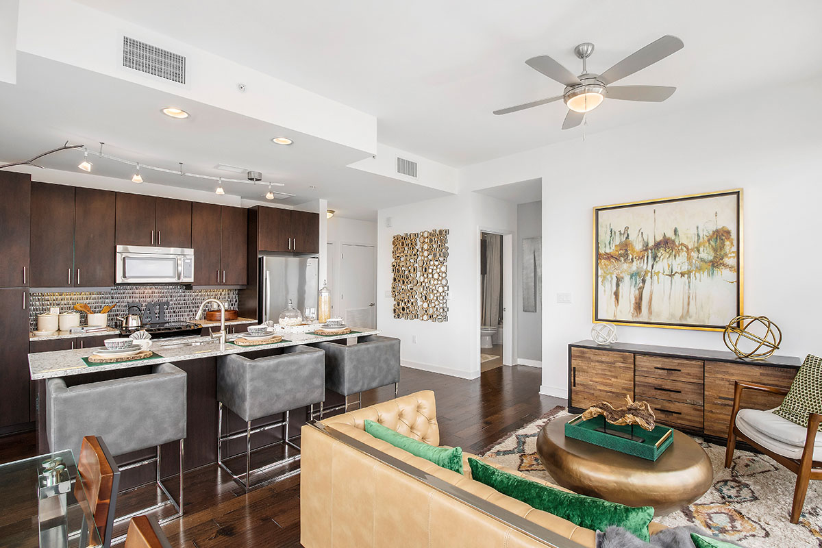 kitchen and living room with brown and green accents